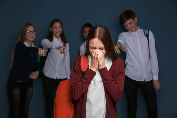 Teens bullying their classmate indoors