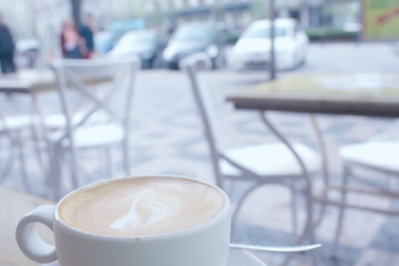 cup of coffee for breakfast in a cafe / serving cup of coffee in modern interior, a European breakfast
