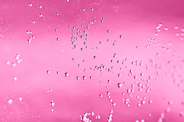 pink water bubbles background / fresh summer background pink air bubbles in water