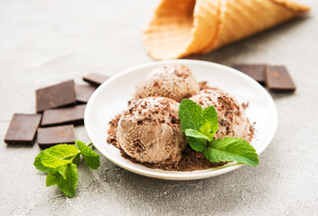 Chocolate ice cream on a stone background