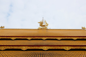 Beautiful Thai Chapel golden roof tile of Wat Nan Ta Ram Temple in Thailand