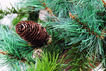Christmas tree decoration with pine cone.