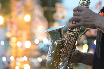 International jazz day and World Jazz festival. Saxophone, music instrument played by saxophonist player musician in fest. - obrazy, fototapety, plakaty