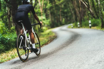 Foto op Plexiglas Cyclist He was cycling uphill climb in the woods. © torwaiphoto