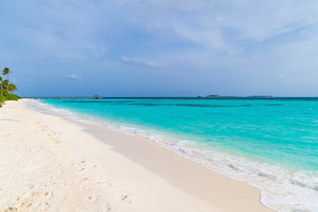 Fototapeta na wymiar Beautiful tropical Maldives island on the beach background.