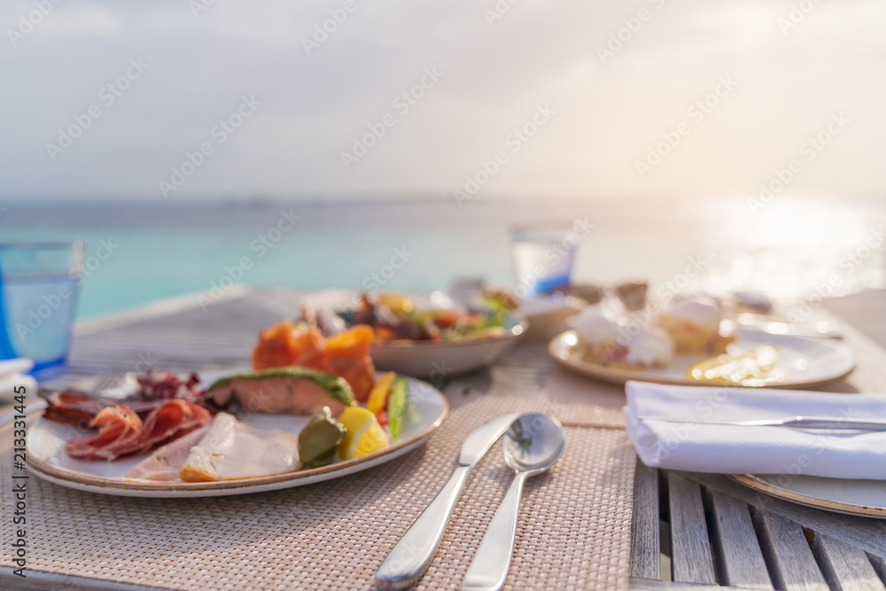 Wall mural luxury breakfast food on wooden table.