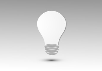 A white light bulb icon with shadow on black and white background