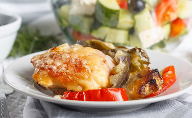 Traditional rustic stew of chicken and vegetables on plate with tomatoes, peppers