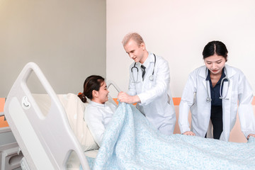 Medical team at the hospital checking paperwork and patient's medical records, healthcare and teamwork concept.