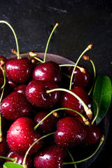 freshly picked cherry in a wooden bowl