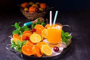 freshly squeezed orange juice with ice in glass