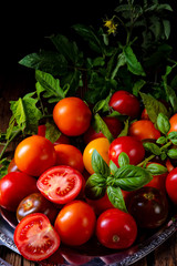 various types of tomatoes served and presented on the silver platter.