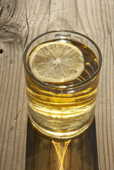 cup of tea with lemon on wooden table