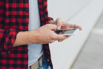 Male ands using a modern mobile phone