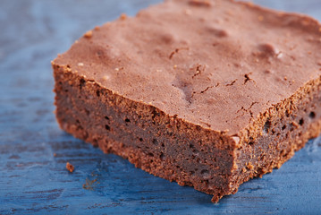 homemade chocolate brownies on dark blue background