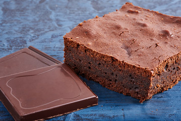 homemade chocolate brownies on dark blue background
