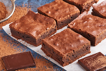 homemade chocolate brownies on dark blue background