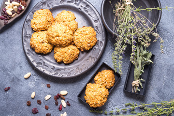 Vegan oat cookies in black ceramic plate