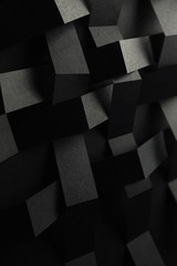 Conceptual composition with black geometric shapes, abstract background	