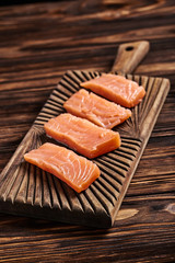 Salted salmon on the wood background
