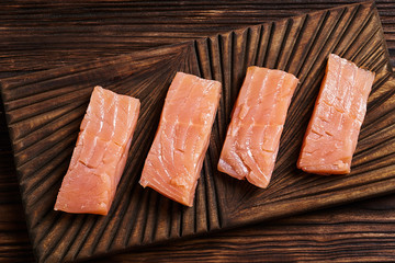 Salted salmon on the wood background