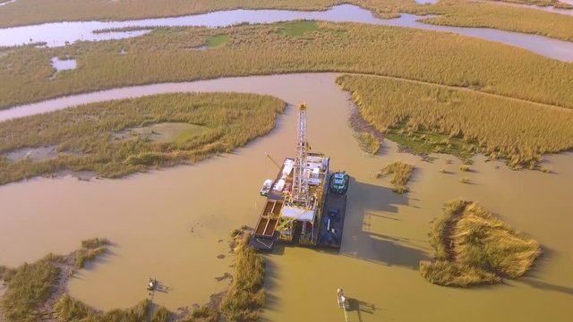 A small drilling rig near the Gulf of Mexico in South Louisiana drilling a well in the marsh.