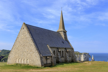 Fototapeta na wymiar Old church on the top of the cliff in Etretat, Normandy, France.