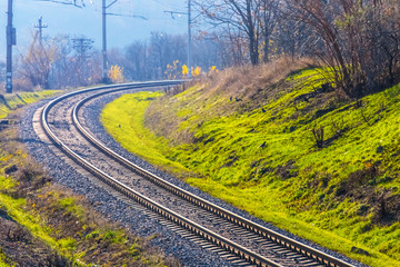 rail road turn through  a forest