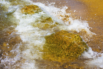 Sea waves hitting the shore rocks