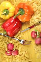 Colorful pasta and vegetables background