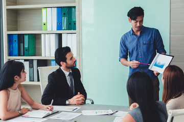 Man making a business presentation to group.