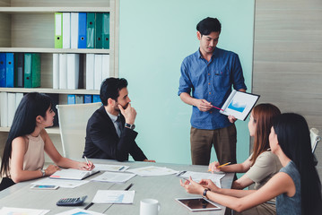 Man making a business presentation to group.