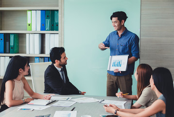 Man making a business presentation to group.