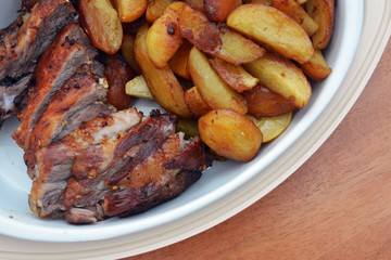 The roasted pork and baked potatoes