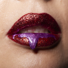 Wet red violet lips with drop