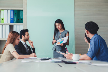 woman making a business presentation to group..
