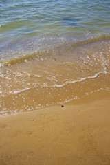 Soft wave of the sea on the sandy beach