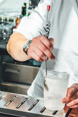 Bartender making alcoholic cocktails! Cocktail bar in summer 