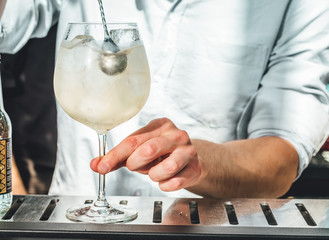 Bartender making alcoholic cocktails! Cocktail bar in summer 
