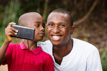 close-up of a man and his child, happy.