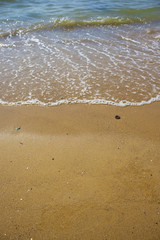 Soft wave of the sea on the sandy beach