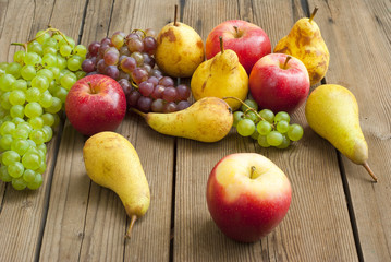 apples grapes and pears, wooden table
