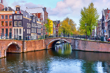 Bridge over channel in Amsterdam Netherlands houses river Amstel