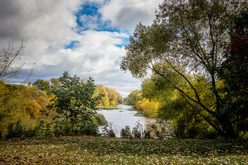 Autumn Park. River and trees in the fall in a good day_