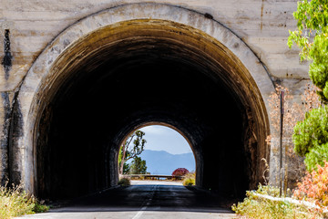 Fototapeta na wymiar Empty mountani road with tunnel in Pellegrino mount in Palermo, Sicily.