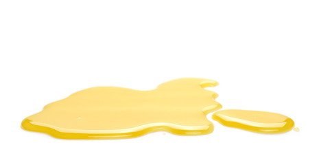 Puddle of orange juice isolated on white background, clipping path