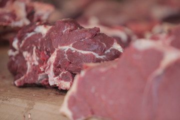 red meat steak detail photography taken on a street african market, on a sunny summer day