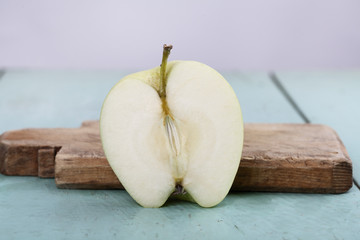 sliced apple half part on wooden background