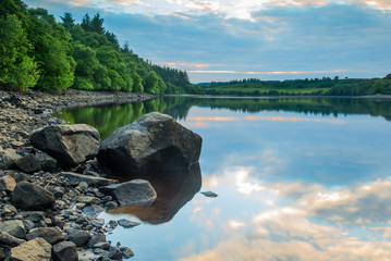 Obraz premium View of Fontburn Reservoir, Northumberland, England, UK, in evening light.