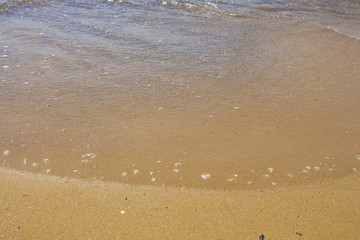Soft wave of the sea on the sandy beach